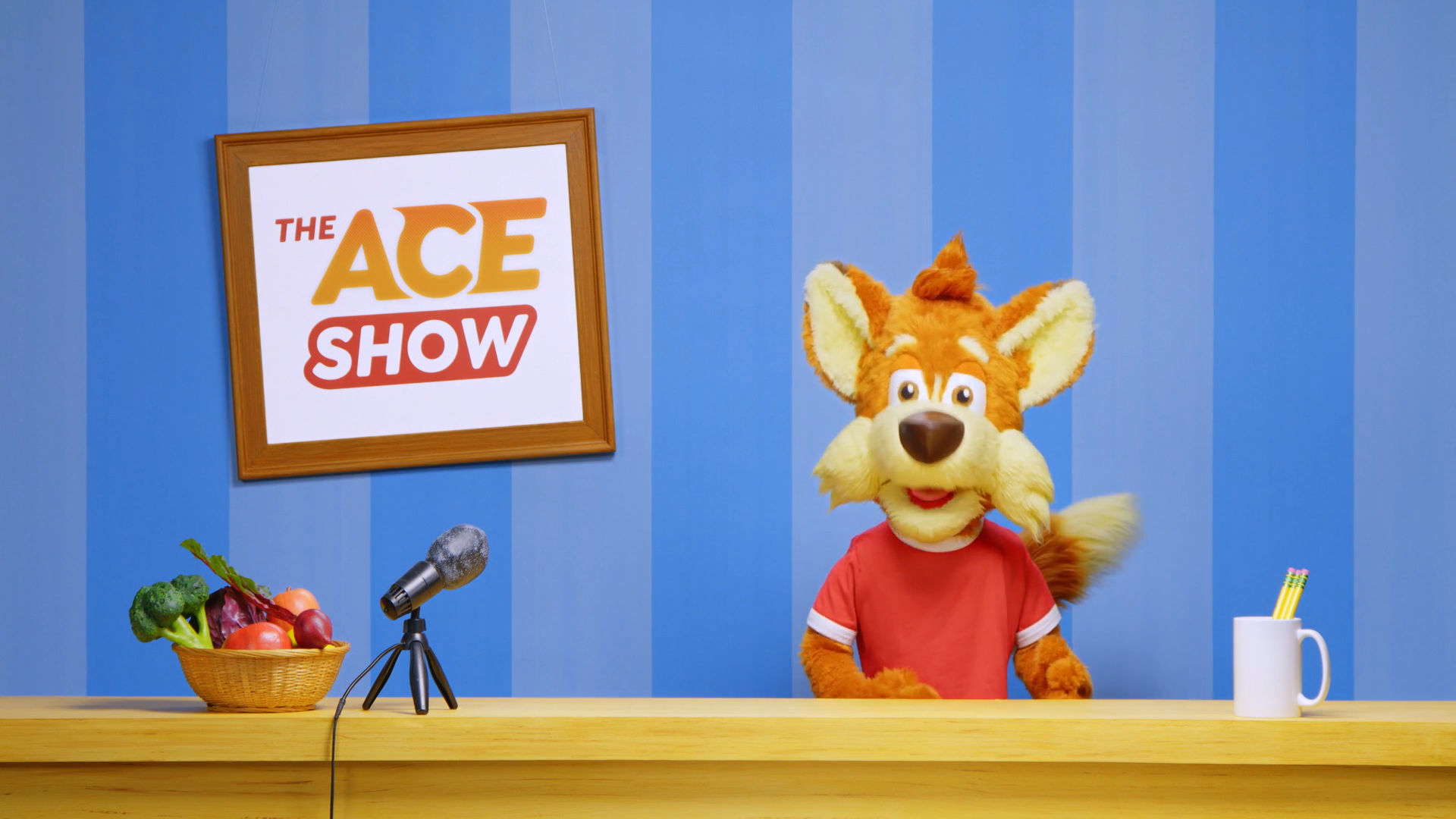 ACE show image with fox and microphone
